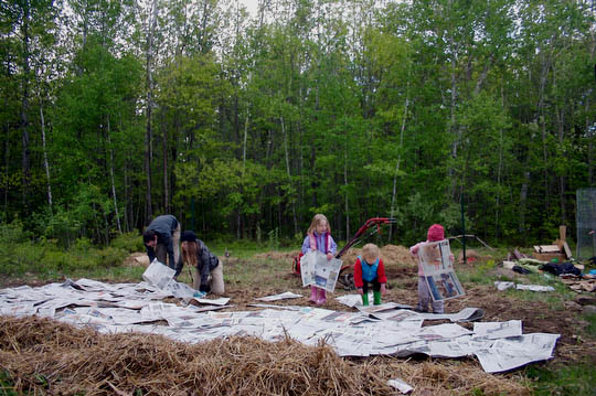 Everyone pitching in to prep Julie, Chris and Aida's garden.